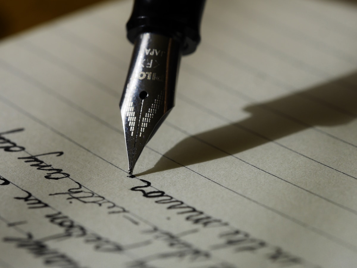 Hand writing notes while studying English